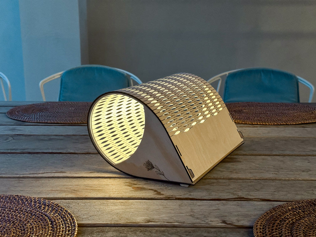 Droplet Cordless Lamp Tall in Natural timber on outdoor table