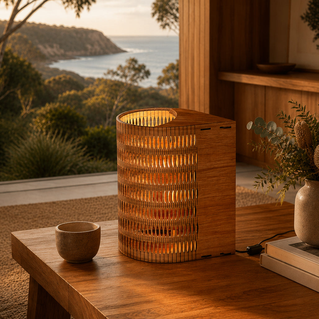 Wooden lamp on a table with a scenic view of trees and water in the background