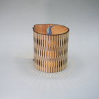 Wooden lamp with a unique design on a gray background