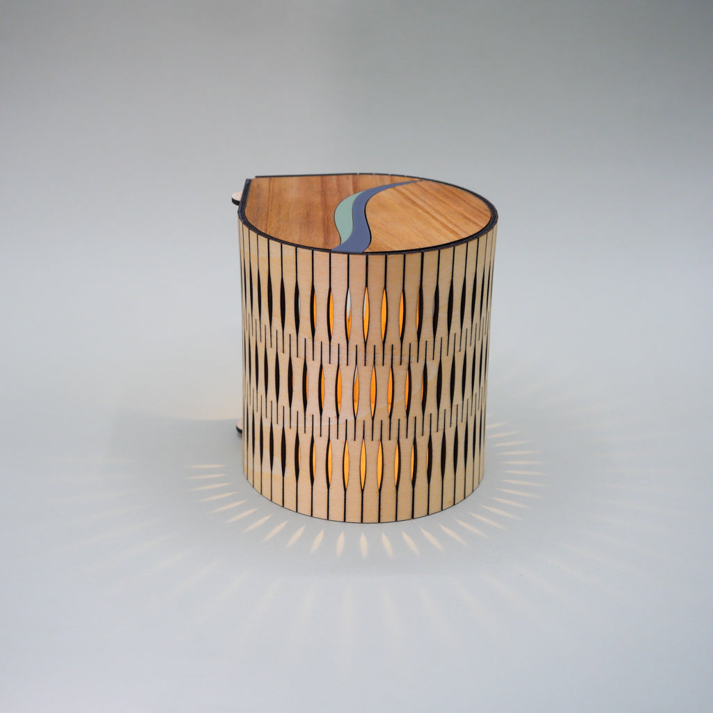 Wooden lamp with a unique design on a gray background