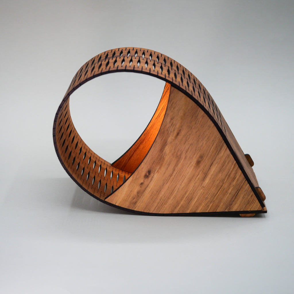 Wooden portable droplet lamp with geometric design on a gray background