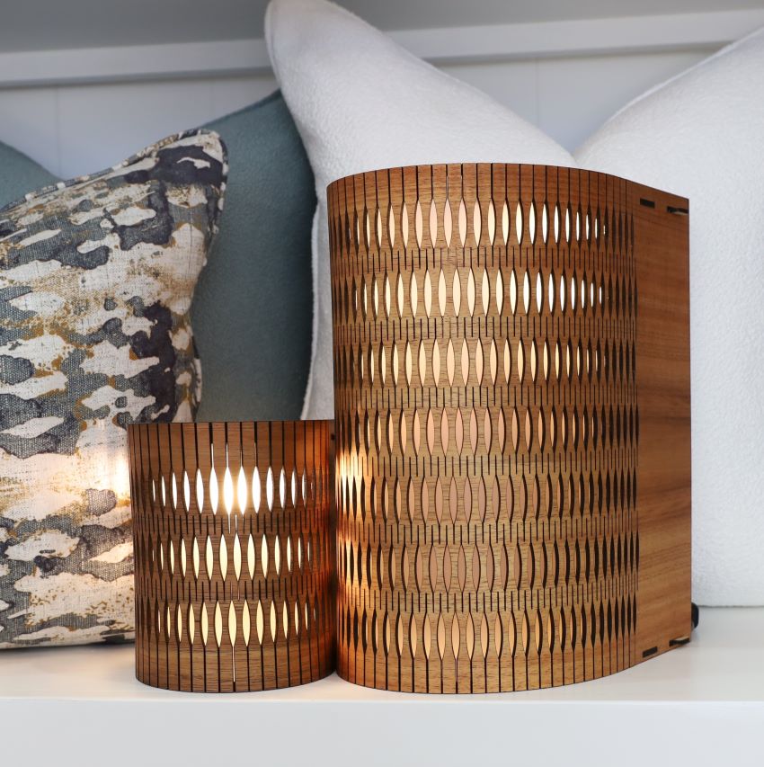 Two RS Studio wooden lamps with a modern design on a white surface.