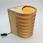 Tall Droplet Lamp with geometric wooden base and warm yellow light