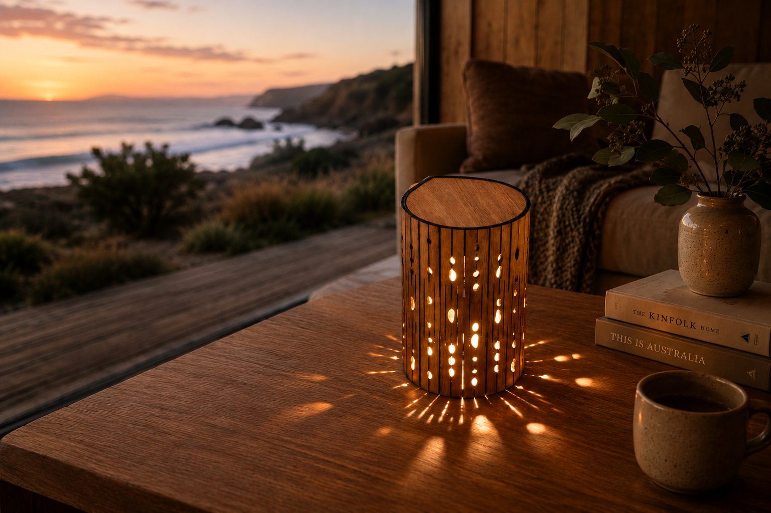 Mood lamp on table with a view of the ocean at sunset